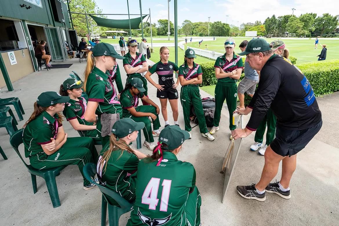 A Magpies coach running a team talk with players